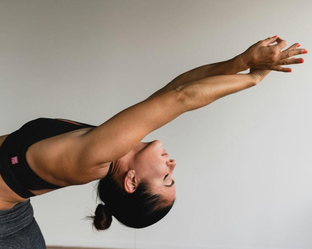 A simple step-by-step visual demonstration of a quick 1-minute seated desk stretch