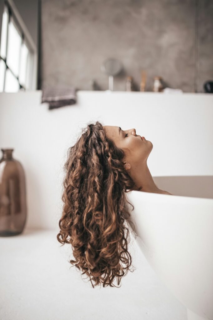 A clean aesthetic view of botanical scalp soothing ingredients and cool water for heat reduction