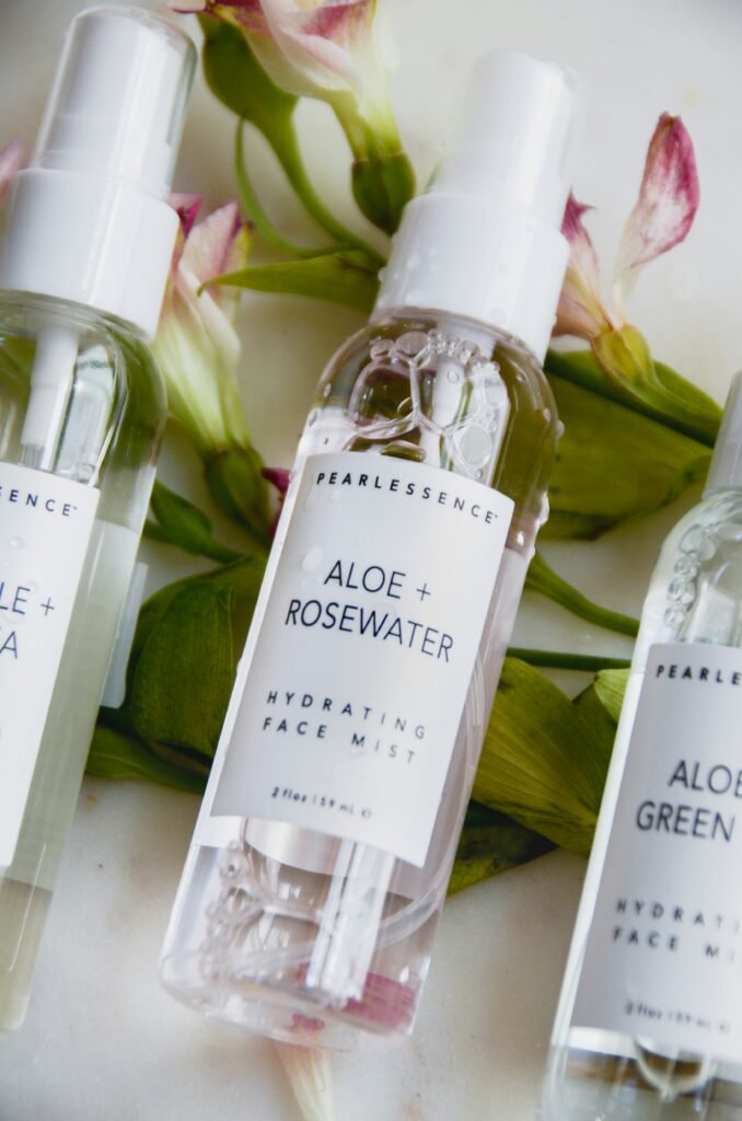 Soothing aloe vera gel texture placed beside a fresh cotton towel on a clean white surface