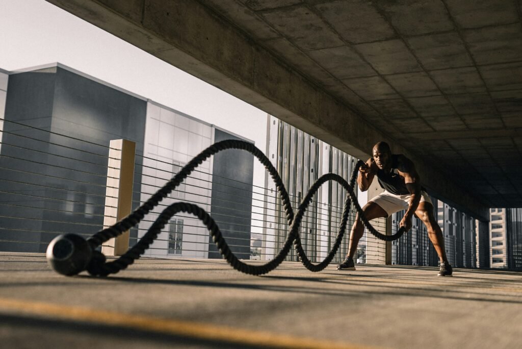 Asymmetric data card list comparing Zone 2 cardio, resistance training, and VO2 Max HIIT for cellular repair