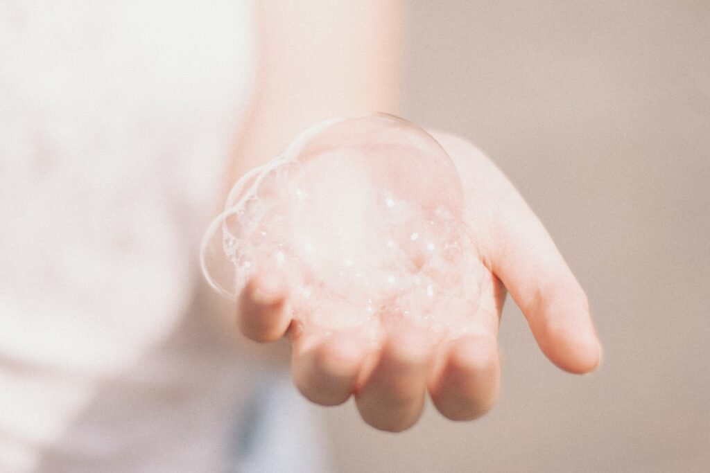 Gentle scalp massage routine with clean fingertips under warm natural light