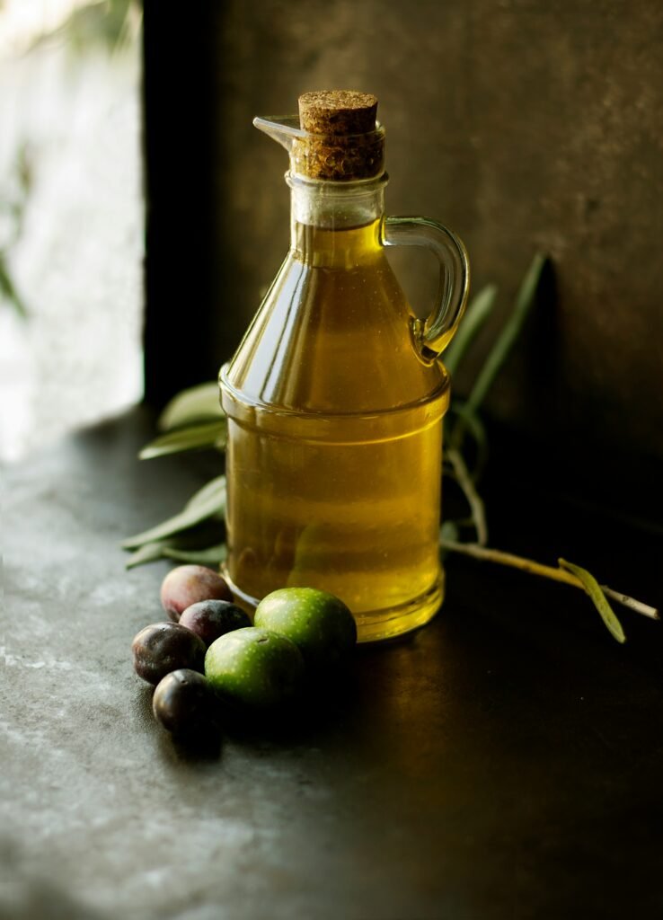 Freshly poured extra virgin olive oil glistening on a simple linen napkin