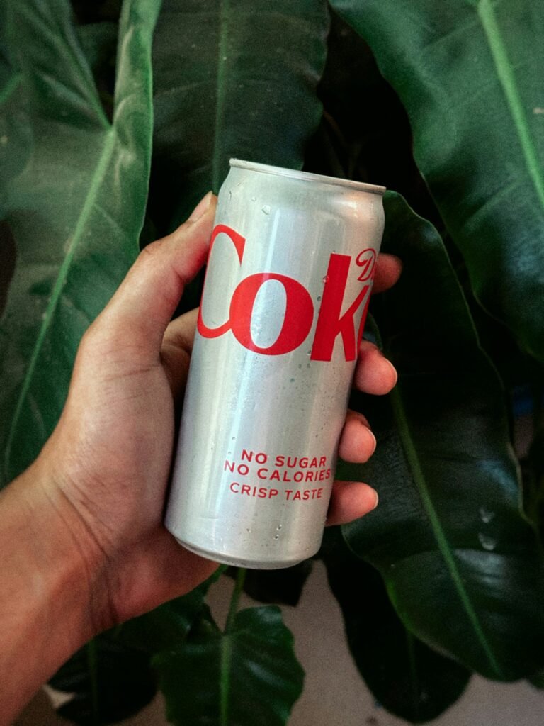 A clean morning cup of black coffee served with a side of natural sugar substitute
